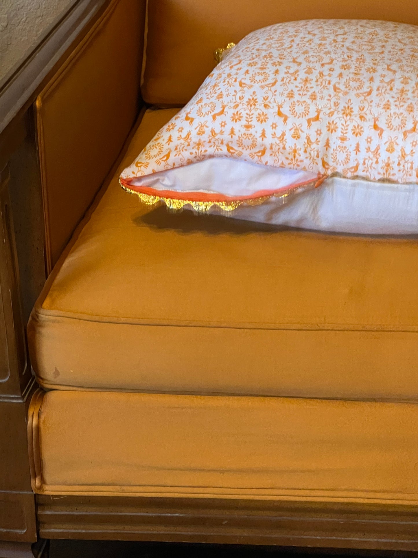 Orange You Glad it's Christmas Pillow with gold rickrack