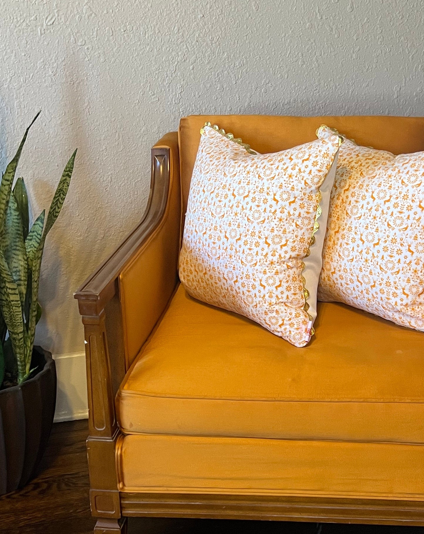 Orange You Glad it's Christmas Pillow with gold rickrack