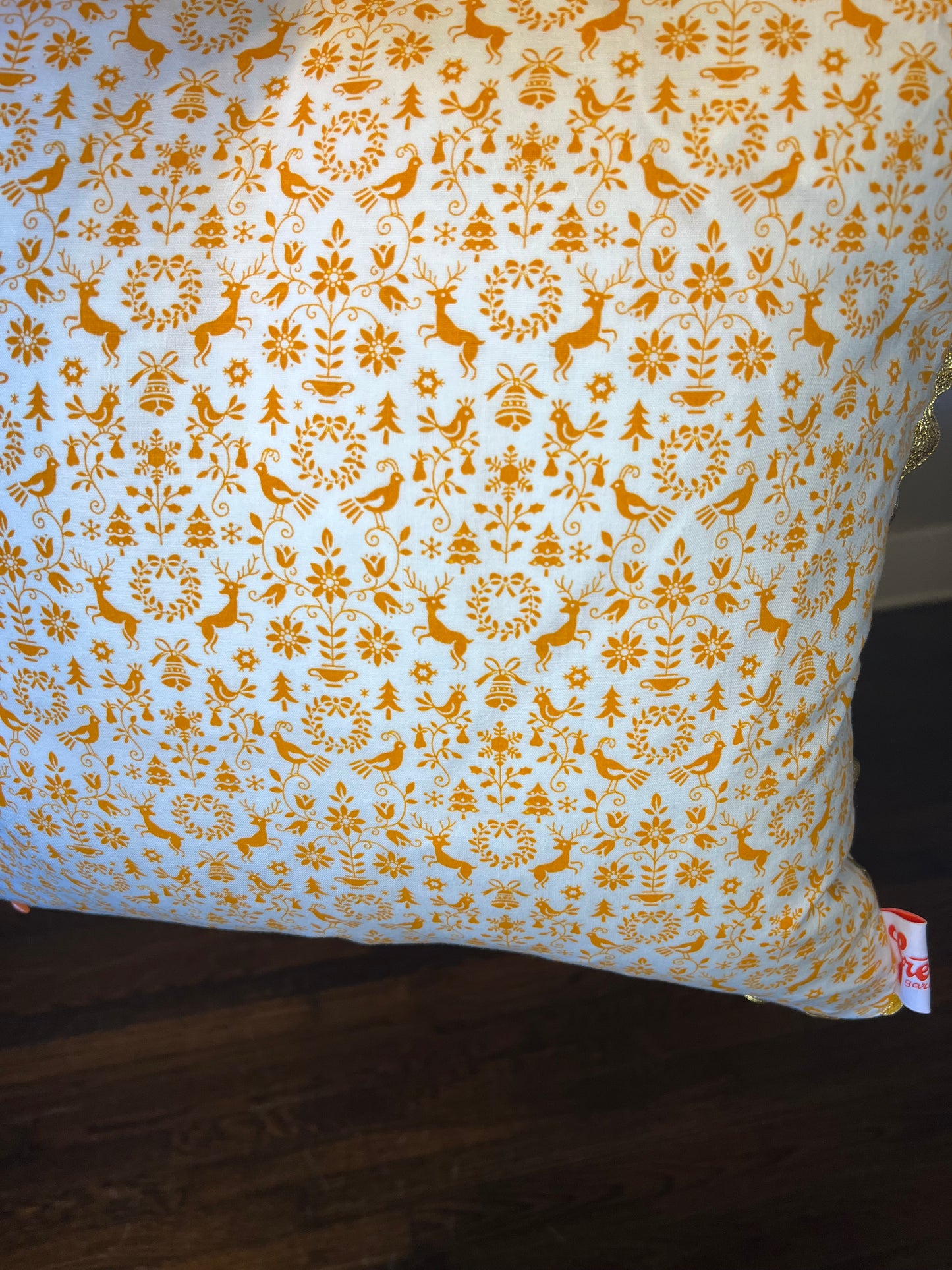 Orange You Glad it's Christmas Pillow with gold rickrack