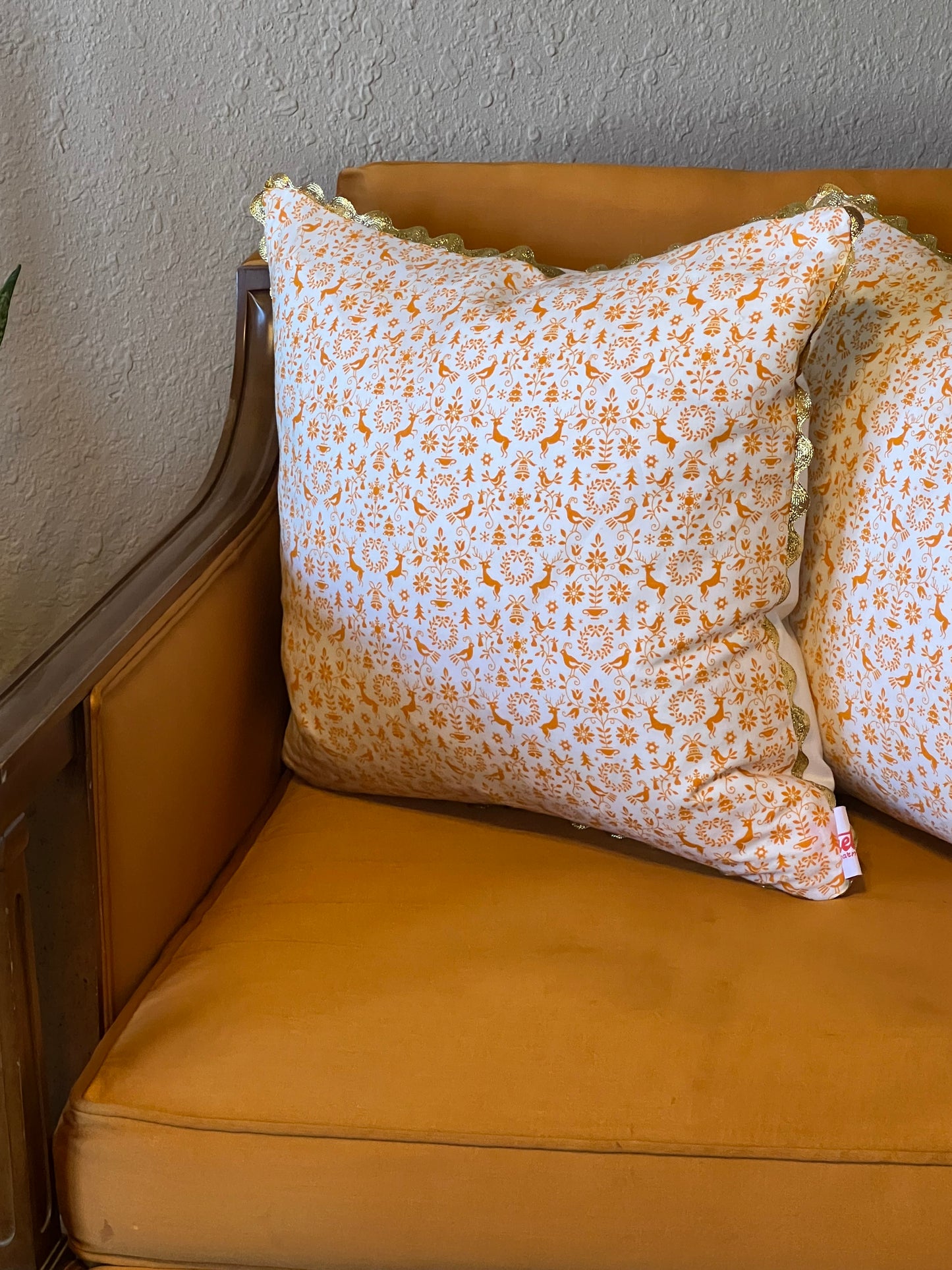 Orange You Glad it's Christmas Pillow with gold rickrack