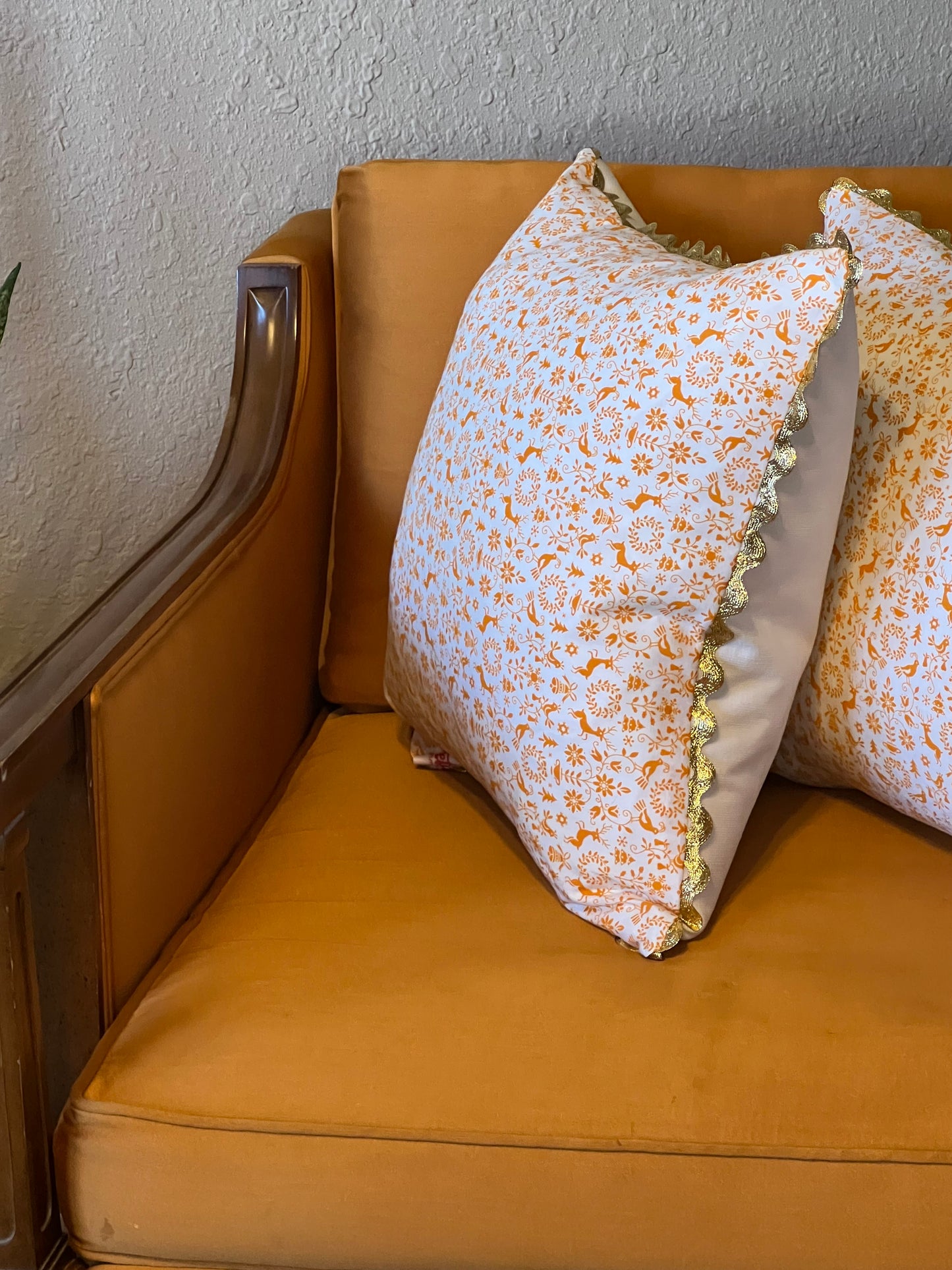 Orange You Glad it's Christmas Pillow with gold rickrack